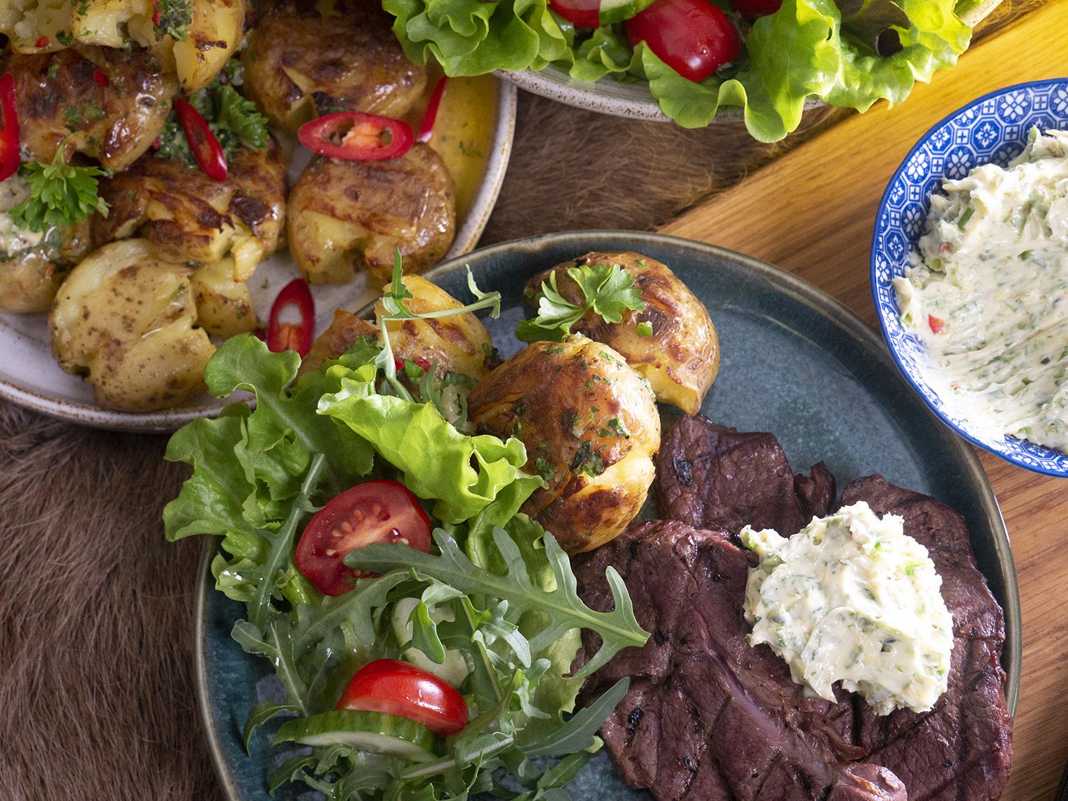 Grilled reindeer topside roast, flattened potatoes, and herb butter - Lapin Liha